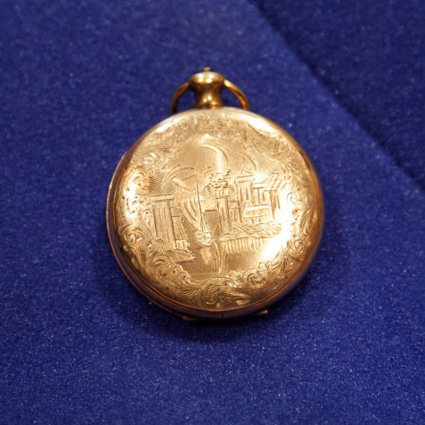 Locket, front cover, ship sailing into harbor Locket, front cover, ship sailing into harbor