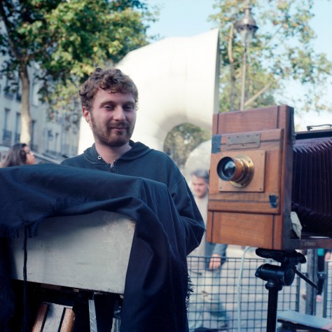 Hans with his camera, processing a photo