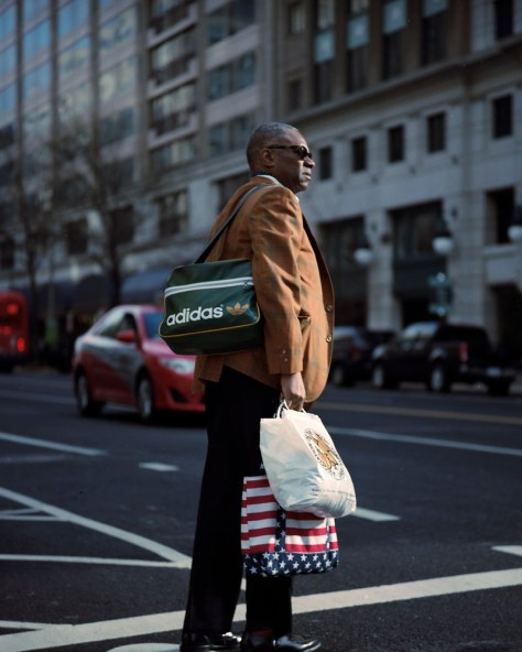 Man Crossing with Bags